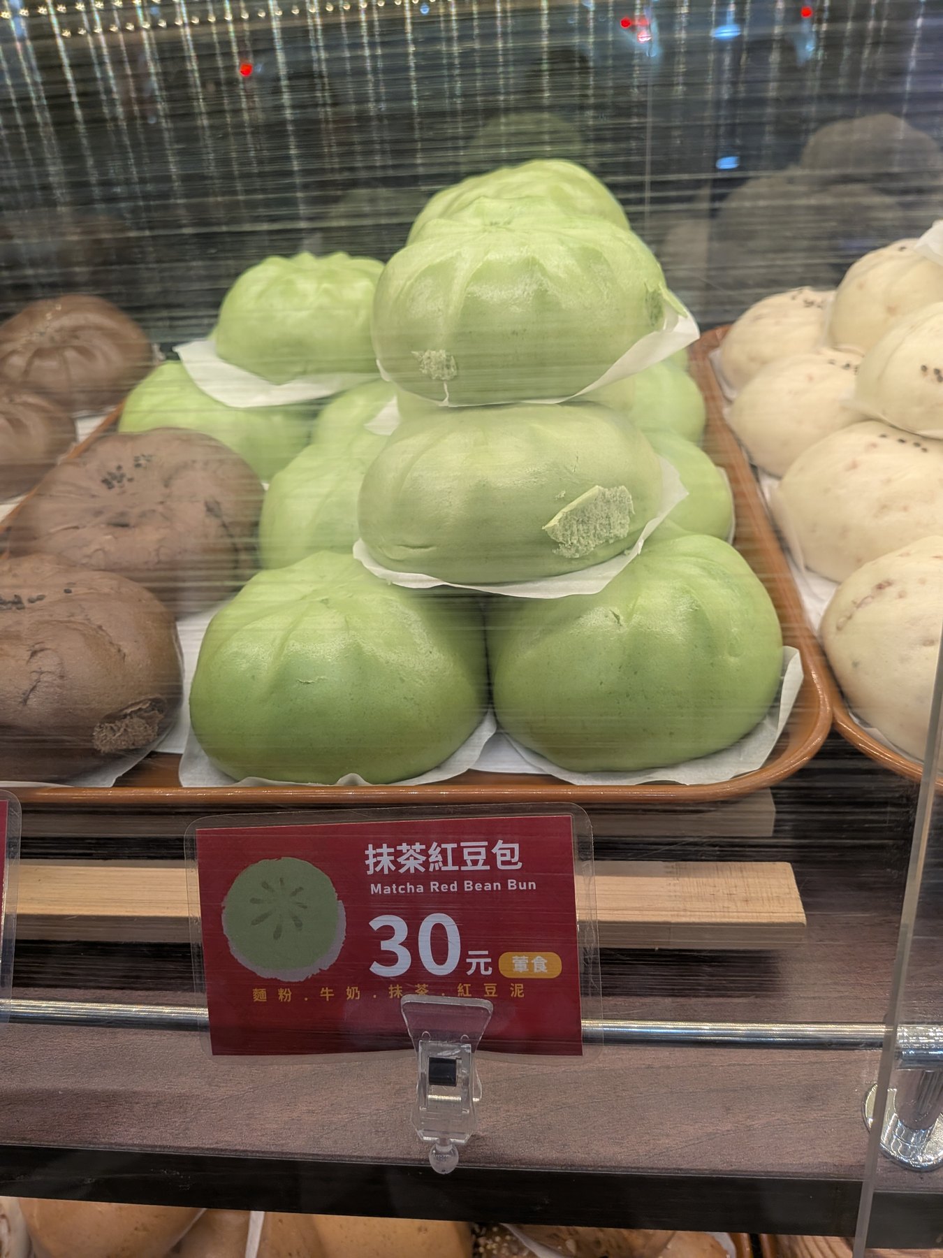 Matcha red bean buns in a Tainan bakery case.